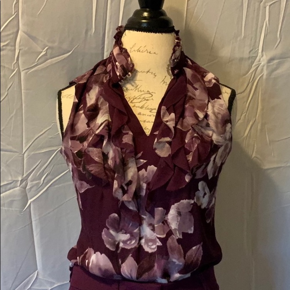 White house black market sleeveless ruffle shirt.